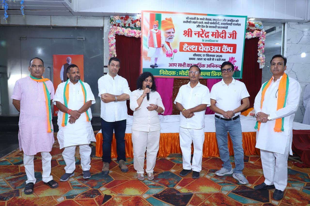 A speaker addressing community members at the camp